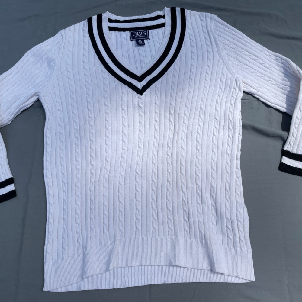 Lightweight white varsity type sweater with black trim.